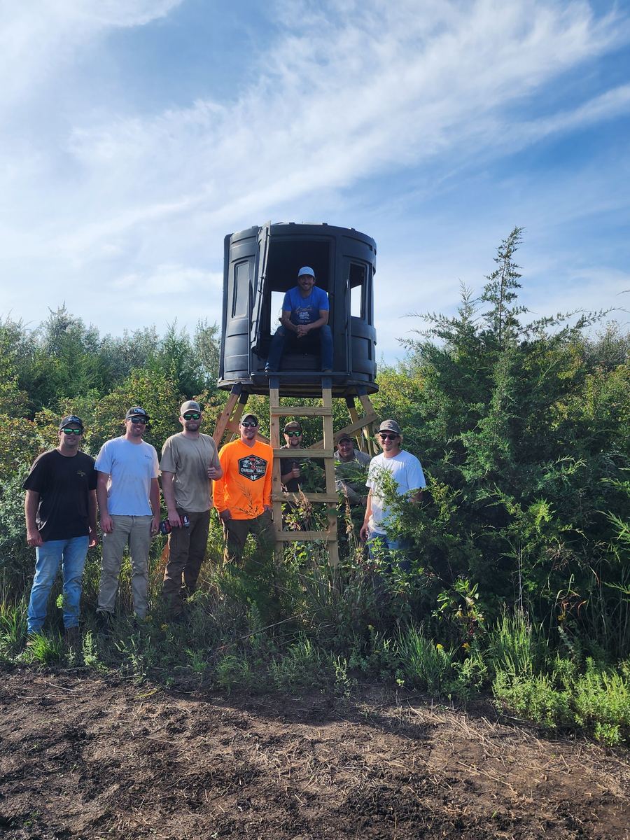 Double P Ranch crew with a newly built elevated enclosed bowhunting blind on a bow property