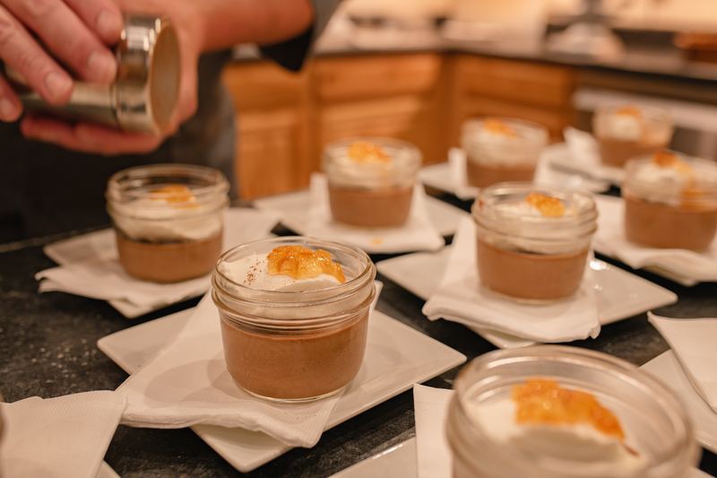 Individual dessert jars being finished for dinner service at the Double P Ranch lodge